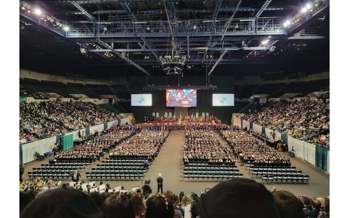 Wideshot of the Wolstein Arena at the fall 2023 CSU commencement ceremony.