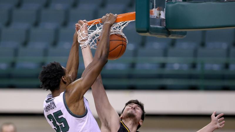 Cleveland State's Deante Johnson slams a dunk during a game against Detroit Mercy on Feb. 13