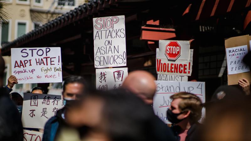 People gather to protest discrimination against Asian, Pacific Islander, and Desi Americans (APIDA).