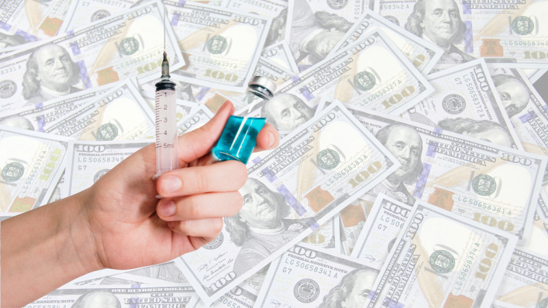 vaccine needle with money backdrop