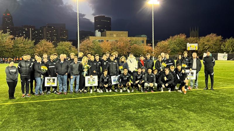 Viking seniors pose with their families after being honored on senior night