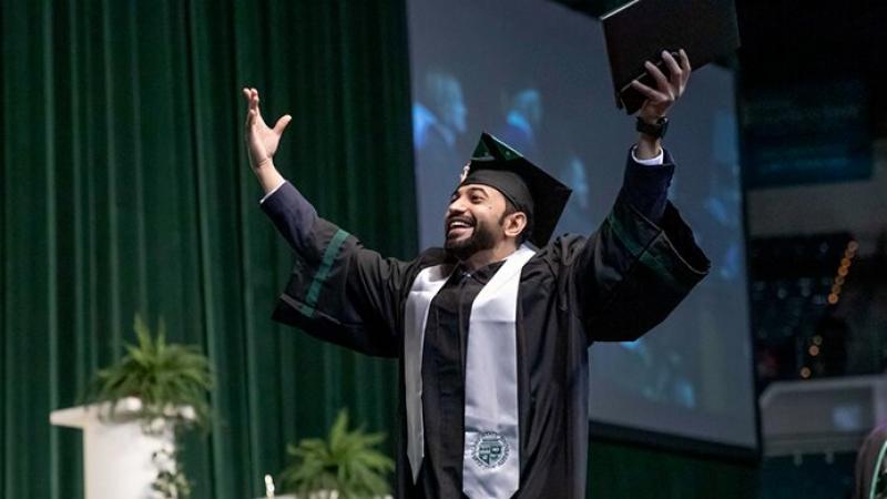 A CSU graduate at commencement. 