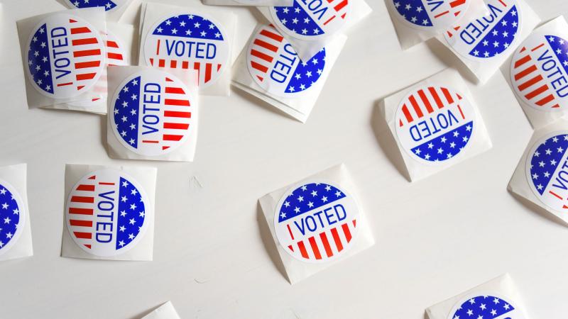 I voted stickers are seen on a white background. 