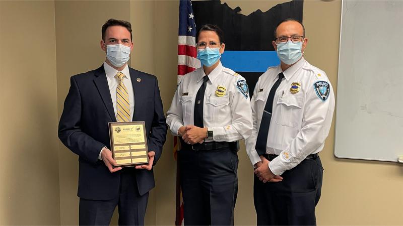 Interim Chief, Captain Beverly Pettrey, center, and former Chief Anthony Traska, right, accept the department's certification; in Cuyahoga Country’s emergency management certification program, Dec. 8, 2021.