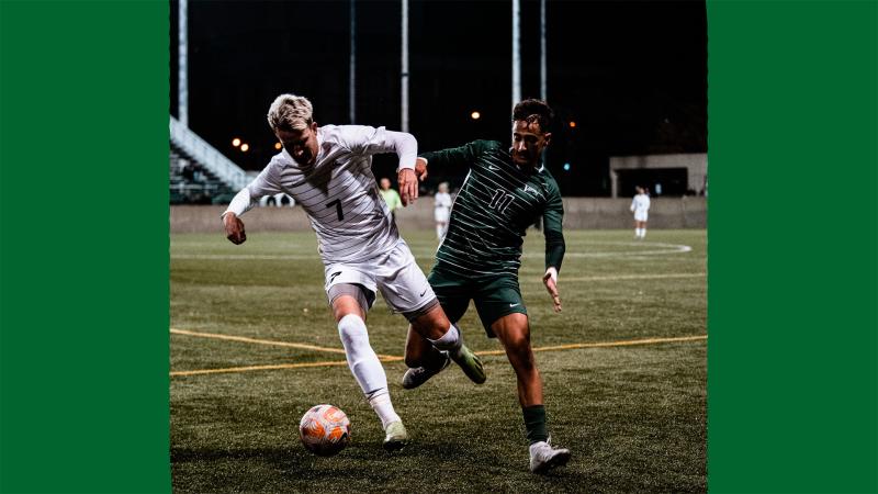 Wright State and Cleveland State soccer players vie for the ball.