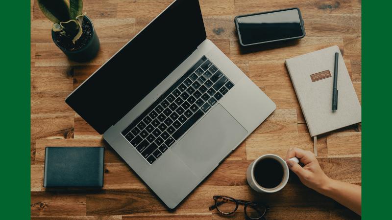 Laptop and coffee on a desk