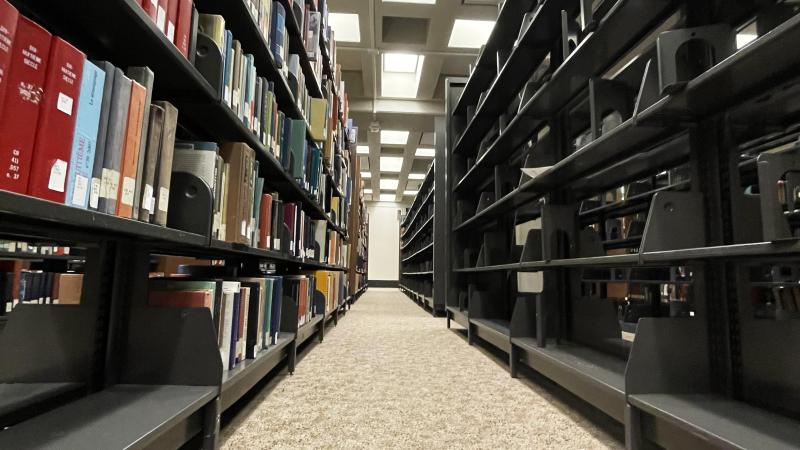 One shelf is barren after the damaged books were removed by the library clean-up team.