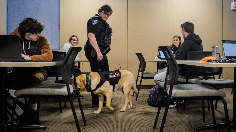 Rune, one of CSU Police Department’s two therapy dogs, and Officer Toni Jones, a Cleveland State police officer and Rune’s handler, visit students at the Science Building on Feb. 16.