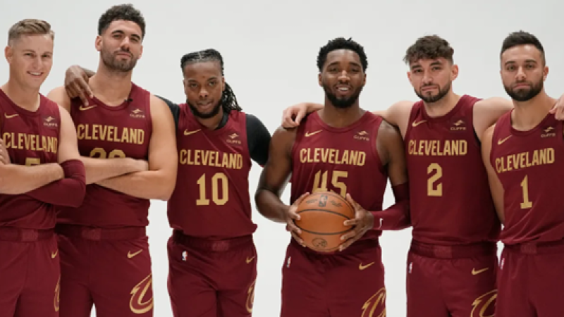 Cavaliers players, from left, Sam Merrill, Georges Niang, Darius Garland, Donovan Mitchell, Ty Jerome and Max Strus pose for a photo during media day, Oct. 2, 2023, in Cleveland.