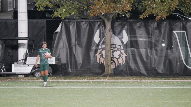 Cleveland state soccer player stands on the sideline preparing for a throw-in.