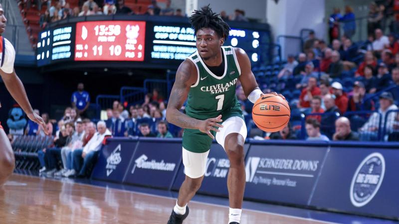 Junio guard Tae Williams dribbles through the paint during the Vikings game against Duquesne