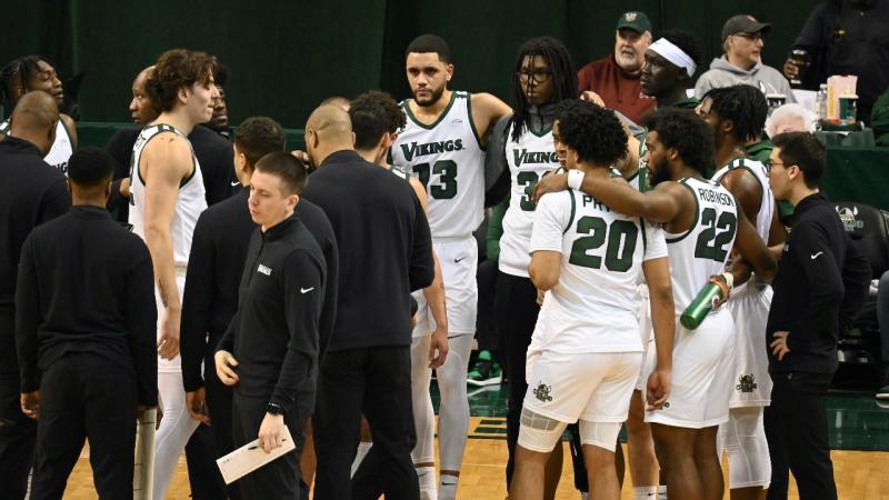 CSU basketball team huddle on Jan.  20 in Henry J. Goodman Arena against Wright State.