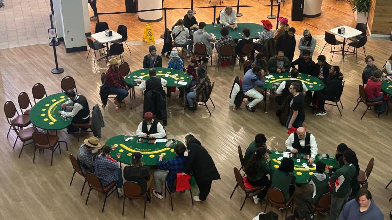 Students playing poker in the first floor of the student center.