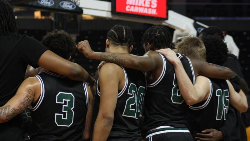 Members of the CSU men’s basketball team huddle during their showdown with Northern Kentucky. 