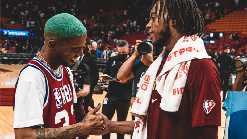 Dec 1, 2021: Kid Cudi daps up Cleveland Cavaliers point guard Darius Garland after the Cavs won against the Miami Heat. 