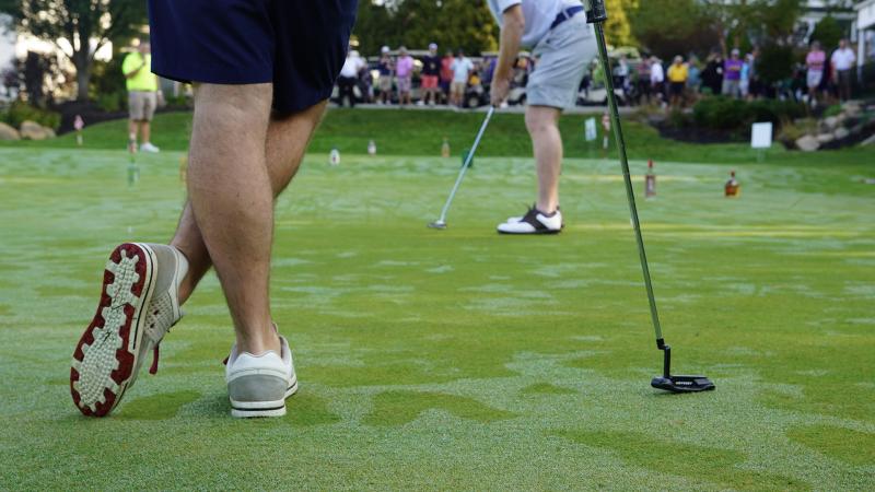 Golfers on the practice putting green at CSU Rec's "Golf Scramble."