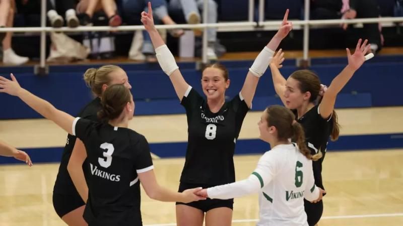 CSU Women's Volleyball team celebrates.