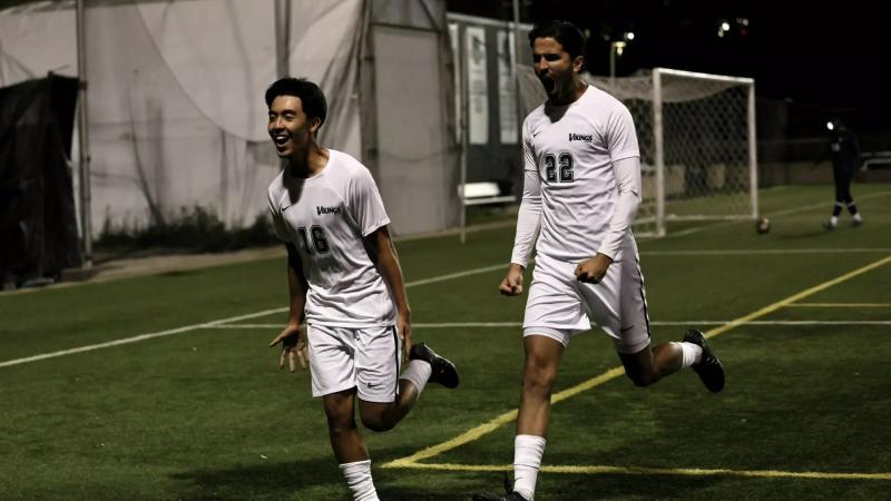 Vikings cheering after scoring a goal.