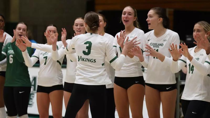 CSU Woman's volleyball team celebrating