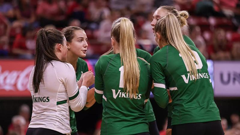 The Vikings huddle before their match against NC State at William Neal Reynolds Coliseum, Saturday, Sept. 13, 2025.