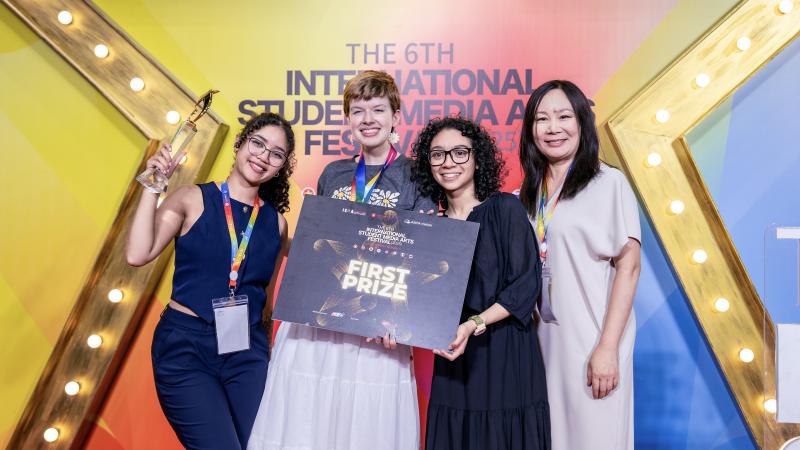 Naliyah Dejesus, left, Kara Nottingham, 2nd left, and Julia Whitaker, 2nd right, with Qian Li, right, professor in the CSU Department of Art and Design, with their 1st prize award at the International Student Media and Arts Festival, Ho Chi Minh City, Vietnam, July 24-30, 2025.