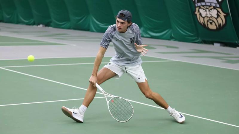 Freshman Tristman Stine goes for a backhand slice at the Vikings Invitational in the Medical Mutual Tennis Center at Cleveland State University on Oct. 26, 2025.   