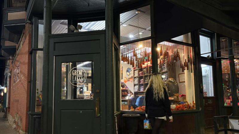 Madilynn Alten looks into the window of the Great Lakes Brewing Company, in Cleveland, Oct. 28, 2025. decor and atmosphere taken by Morgan Alten