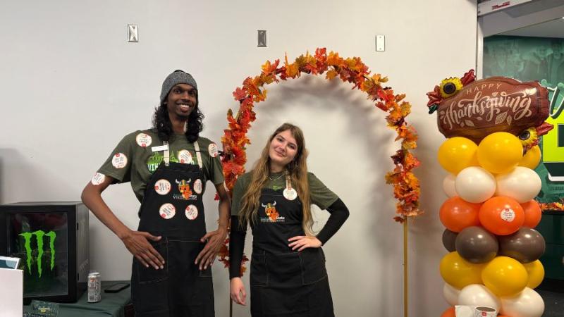 Student volunteers at the entrance of Vikesgiving, handing out “Thankful For You” stickers, Nov. 20, 2025. (credit: Morgan Alten)