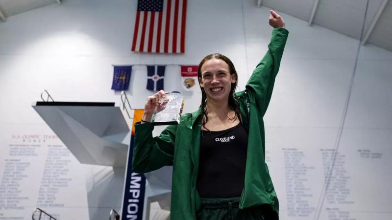  Ellie Seiter holds her 1-meter diving championship award at the Horizon League Championship on Feb. 20, 2026.