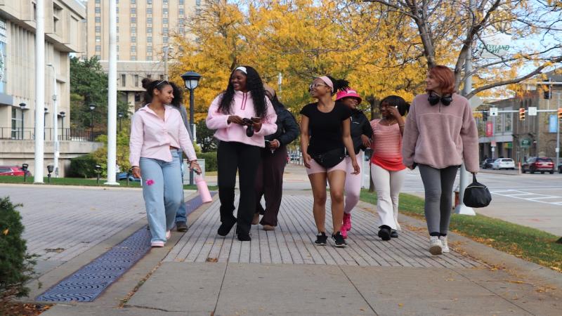 Students walked through downtown Cleveland in honor of Breast Cancer Awareness Month on Oct. 15, 2026.  Left to right: CSU Run Club President Ashlee Mottl, New Era Scholars Treasurer Lakira Harrel, New Era Scholars Community Coordinator Angellise Gray