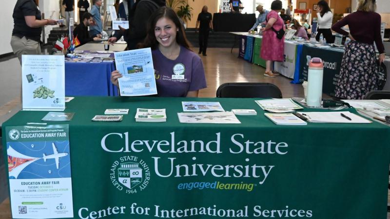 Ruthie Sasso, Education Away graduate assistant, at the fair welcome table on Oct. 6, 2026.