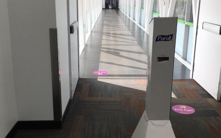 Credit: Jeremy Butcher The Cleveland State InnerLink is a popular path to walk around campus. To accommodate safety guidelines, the InnerLink has sanitation stations along with prompts on the ground to promote distancing.