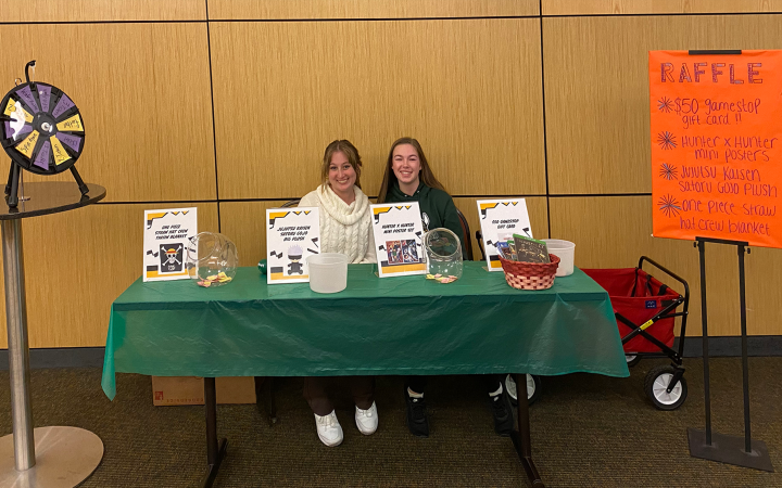 Two CSU students run the raffle table during VikeCon.