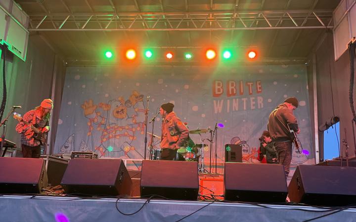 Skuff Micksun, center, and his band prepare for their first-ever set at the annual non-profit show, Brite Winter, on Feb. 25 in Cleveland, Ohio. 