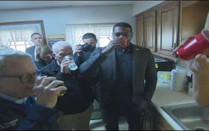 Ohio Gov. Mike DeWine, left, Rep. Bill Johnson of Ohio, center, and Michael Regan, the head of the U.S. Environmental Protection Agency, drank tap water in East Palestine on February 21st in an attempt to show it’s safe.