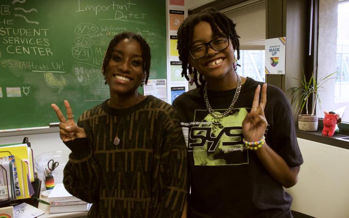 Amari McNeily (left, she/they), a biology major, and Naiy Birch (right, they/them), also a biology major, pose for a picture at the Pride Mixer