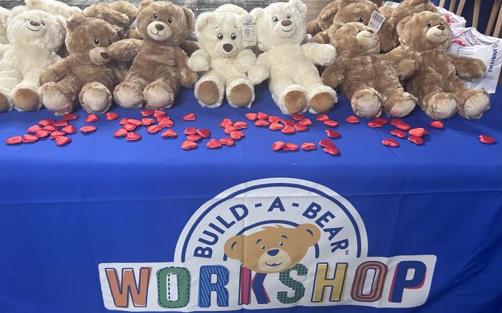 A table with Build-A-Bears and felt hearts.