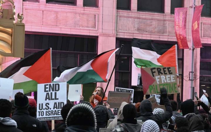The pro-Palestine supporters led by a speaker in front on the KeyBank State Theatre, on Nov. 20, 2023, in Cleveland, Ohio.
