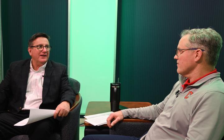 Jim Kahler, left, Director of the Sports & Entertainment Management Program at Cleveland State University and Brian Barren, right, Cleveland Guardians President of Business Operations before Barren interviewed Kahler, Feb. 20, 2024, at Cleveland State University. (credit: Alex Martinez).
