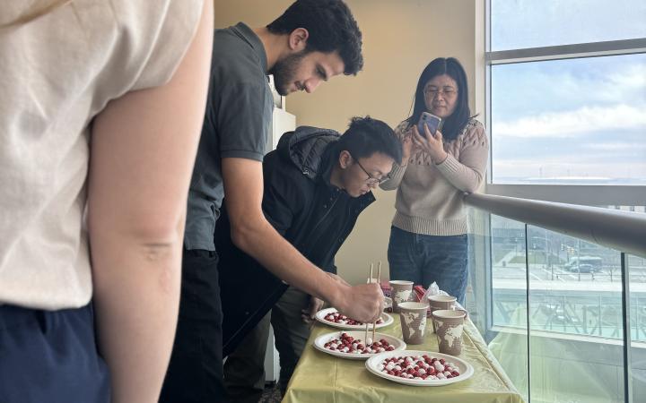  Students played games, including one called Chopstick Master. In this game, the participants had 30 seconds to transfer as many balls into a cup with chopsticks.