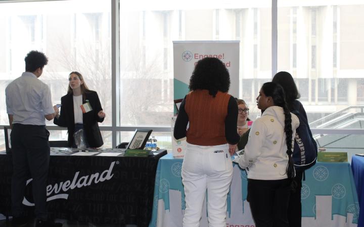 Student, left, speaks with a Destination Cleveland Recruiter, a non-profit destination marketing and management organization for Cuyahoga county. This organization helps people discover the authenticity of Cleveland. 