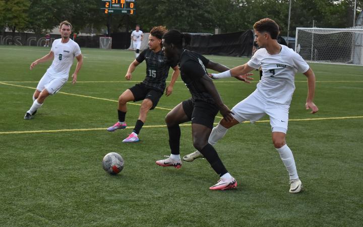 Midfielder RC Schmeider (8), left, rushes over to assist Marko Rimac (7) in taking the ball back from Chicago State. (credit: Alex Martinez).