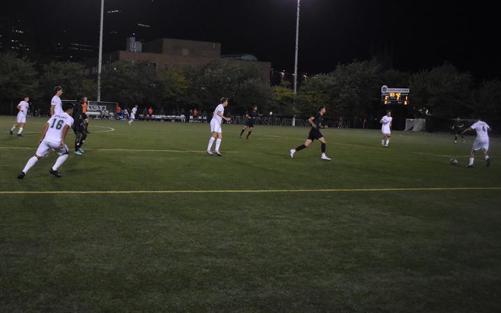 Caleb Trowbridge (4), right, passes the ball to freshman Oskar Von Esebark (14). (credit: Alex Martinez).