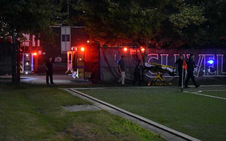 A firetruck and ambulance arrive with a stretcher for the injured Chicago State player. (credit: Alex Martinez).