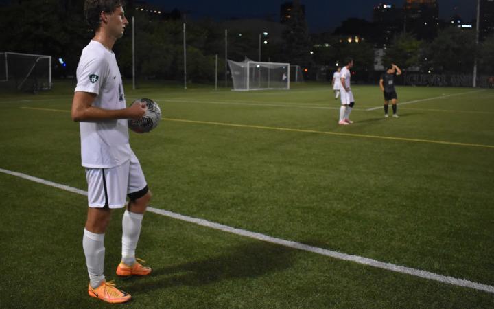 Marko Rimac (7) and others leave the field for the halftime break. (credit: Alex Martinez).