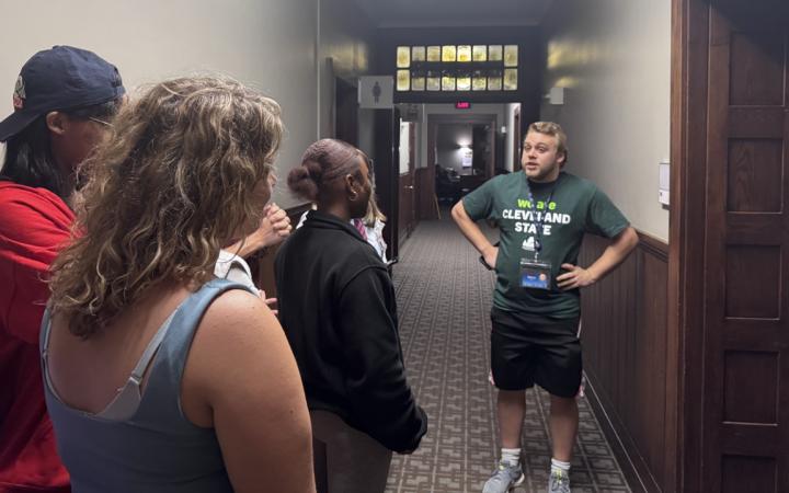 CSU RA Christian Darrin leads a group of students on a ghost tour through Mather Mansion 