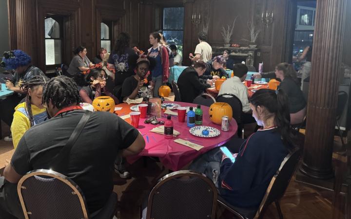 CSU students paint mini foam pumpkins in the craft room 