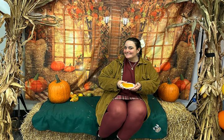 Student Sophie Farrar poses for photo before taking a slice of pie back to her friend who could not attend Vikesgiving.