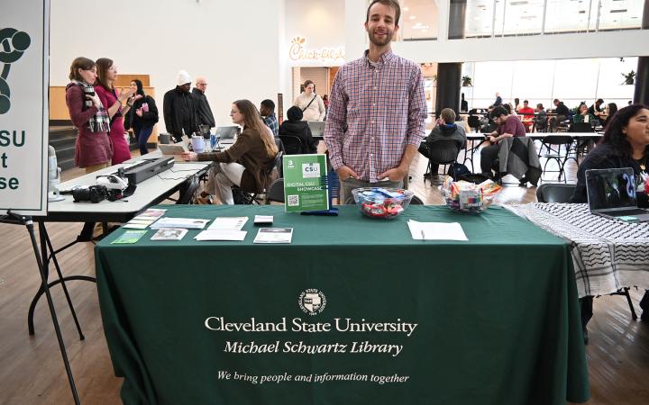 Librarian Ben Richards, who coordinates the CSU Digital showcase, waits for to sign in for the event, Dec. 3, 2024. (credit: Alex Martinez) 