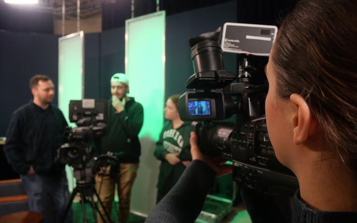 Broadcast minor student Kelly Calhoon films students working with Classic Teleproductions in class.